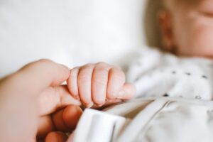 Person Holding Baby's Hand